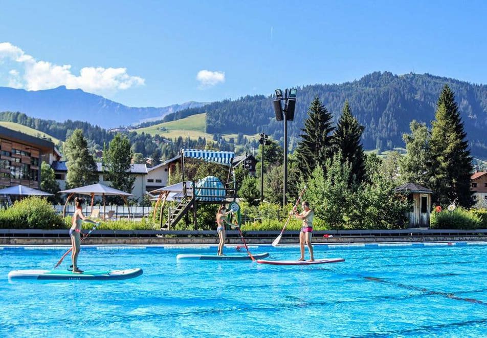 Paddleboarding on the outdoor pool in Megeve